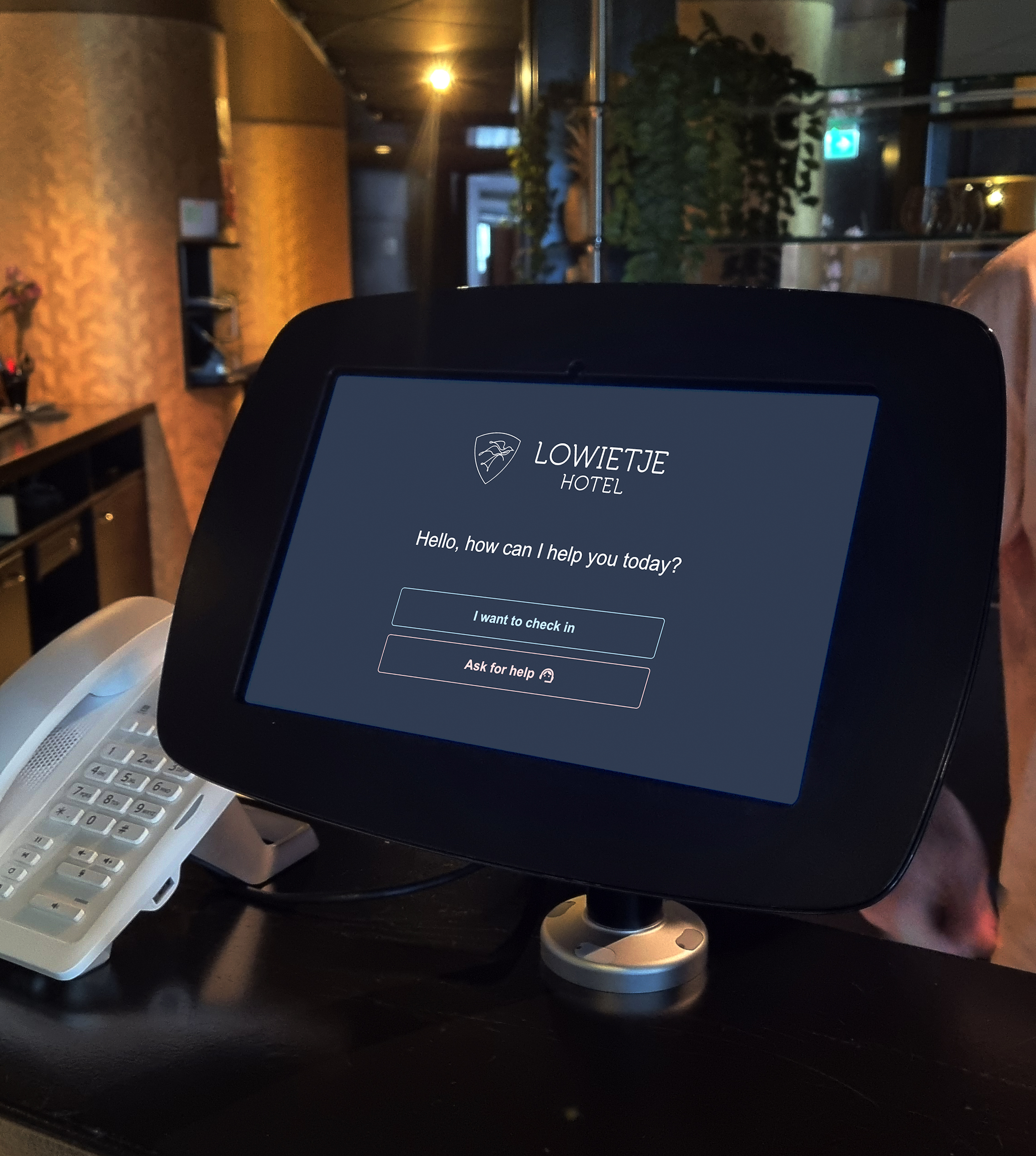 Guest using check-in kiosk